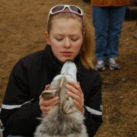 Acadia looks up to a young Girl Scout.