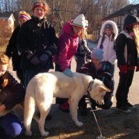 A young Girl Scout poses with Okemo.