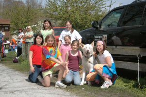 Okemo looks happy to pose with Girl Scouts