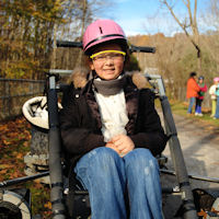 Girl Scouts enjoy opportunity to go dryland dog sledding.