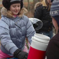 The Girls Scouts helped to feed and hydrate the dogs prior to the dryland dog sledding run.