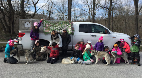 Happy scouts and sled dogs after a day on the trail