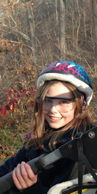 An excited girl scout before her ride