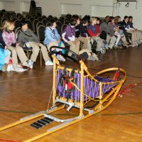 Third grade class learns dog sledding.