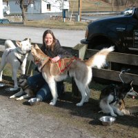 Pam poses with the sled dog team after her ride.